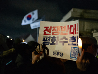 Hundreds of citizens gather in front of the National Assembly in Seoul, South Korea, on December 4, 2024, demanding the repeal of the martia...