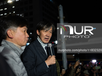 Cho Kuk, the leader of the Rebuilding Korea Party, stands in front of the National Assembly to address citizens about the emergency martial...