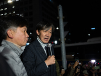 Cho Kuk, the leader of the Rebuilding Korea Party, stands in front of the National Assembly to address citizens about the emergency martial...