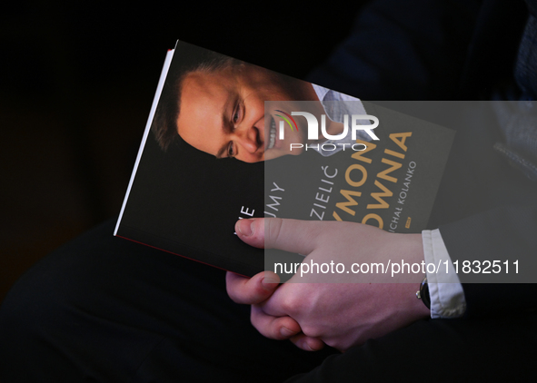 KRAKOW, POLAND - DECEMBER 3:   
A participant holds a copy of Michal Kolanko's book 'Szymon Holownia – Nie dajmy się podzielic' (Szymon Holo...