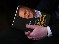 KRAKOW, POLAND - DECEMBER 3:   
A participant holds a copy of Michal Kolanko's book 'Szymon Holownia – Nie dajmy się podzielic' (Szymon Holo...