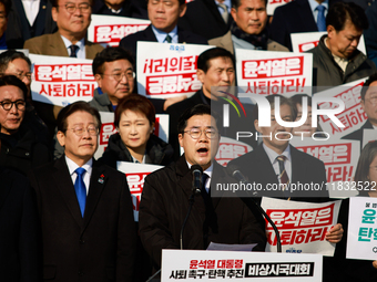 Park Chan-dae, floor leader of the Democratic Party of Korea, delivers a speech at an opposition coalition rally in front of the National As...