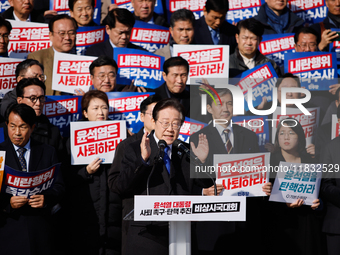 Lee Jae-myung, leader of the Democratic Party of Korea, delivers a speech at an opposition coalition rally in front of the National Assembly...