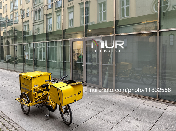 A DHL postman is in Dresden, Saxony, Germany, on March 19, 2022. Due to a new draft law, consumers have to wait longer for a letter in the f...