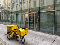 A DHL postman is in Dresden, Saxony, Germany, on March 19, 2022. Due to a new draft law, consumers have to wait longer for a letter in the f...