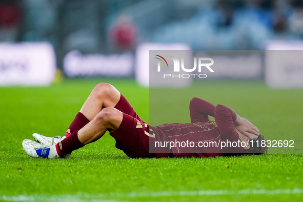 Paulo Dybala of AS Roma lies down injured during the Serie A Enilive match between AS Roma and Atalanta BC at Stadio Olimpico on December 02...