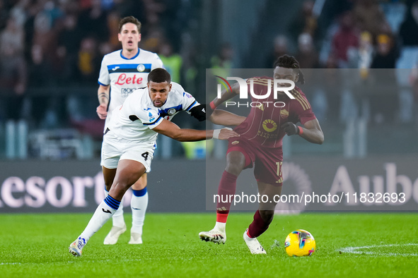 Isak Hien of Atalanta BC and Manu Kone' of AS Roma compete for the ball during the Serie A Enilive match between AS Roma and Atalanta BC at...