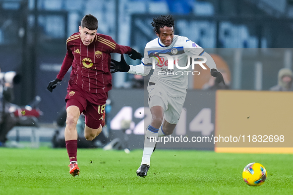 Juan Cuadrado of Atalanta BC and Matias Soule' of AS Roma compete for the ball during the Serie A Enilive match between AS Roma and Atalanta...