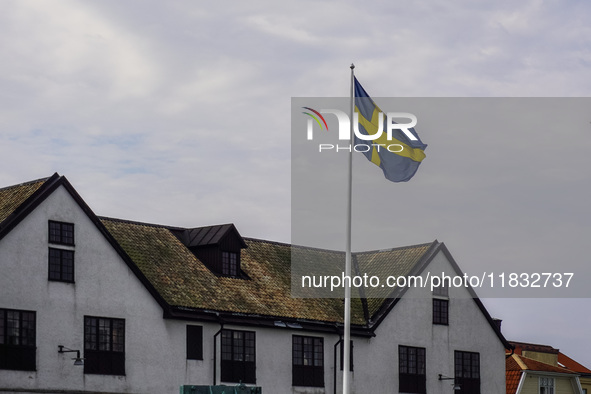 The Swedish flag is in front of the Naval Museum building (Marinmuseum) in Karlskrona, Sweden, on August 15, 2024. 