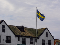 The Swedish flag is in front of the Naval Museum building (Marinmuseum) in Karlskrona, Sweden, on August 15, 2024. (