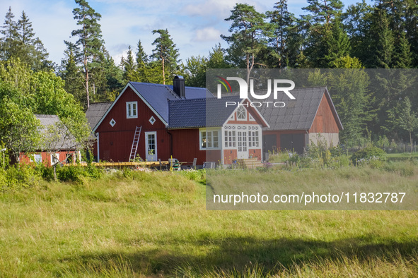 A traditional red-painted house is seen in Markaryd, Sweden, on August 8, 2024. 