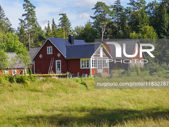 A traditional red-painted house is seen in Markaryd, Sweden, on August 8, 2024. (