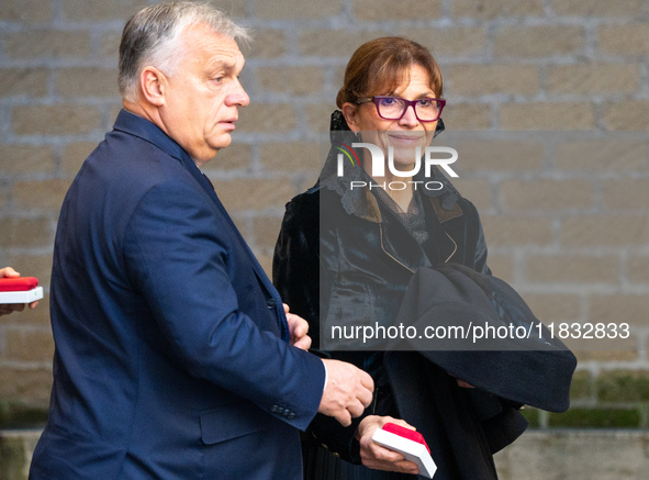 Hungary's Prime Minister Viktor Orban and his wife Aniko Levai arrive for a meeting with Pope Francis at The Vatican on December 4, 2024. 