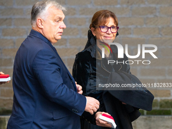 Hungary's Prime Minister Viktor Orban and his wife Aniko Levai arrive for a meeting with Pope Francis at The Vatican on December 4, 2024. (