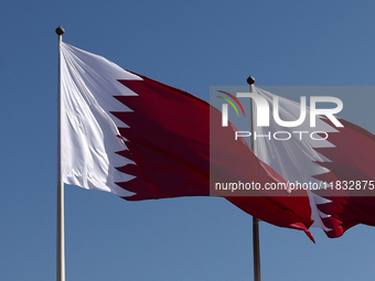 Flags of Qatar are seen near the National Museum of Qatar in Doha, Qatar on December 3, 2024. (