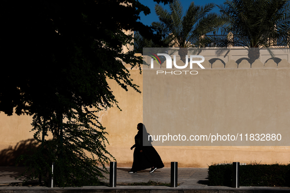 A woman wearing hijab walks in Doha, Qatar on December 3, 2024. 