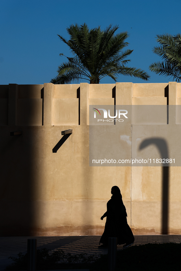 A woman wearing hijab walks in Doha, Qatar on December 3, 2024. 