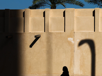 A woman wearing hijab walks in Doha, Qatar on December 3, 2024. (