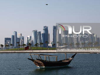 A view of the city and a wooden boat in Doha, Qatar on December 3, 2024. (