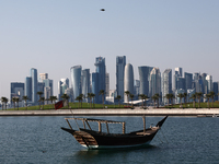 A view of the city and a wooden boat in Doha, Qatar on December 3, 2024. (