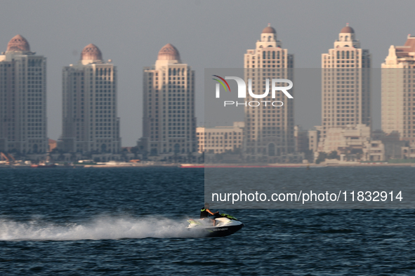 A person rides a jet ski at Doha Bay in Doha, Qatar on December 3, 2024. 