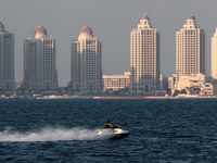 A person rides a jet ski at Doha Bay in Doha, Qatar on December 3, 2024. (