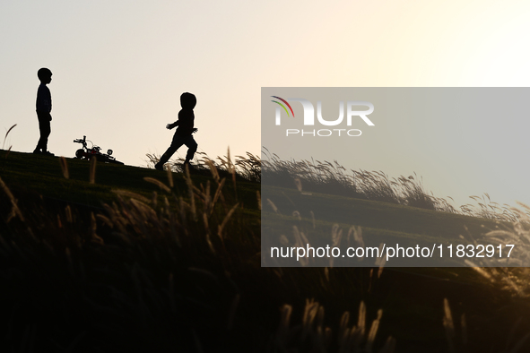 A kid runs in Doha, Qatar on December 3, 2024. 