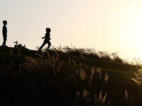 A kid runs in Doha, Qatar on December 3, 2024. (