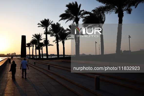 The 7 Sculpture and palm trees are seen in Doha, Qatar on December 3, 2024. 