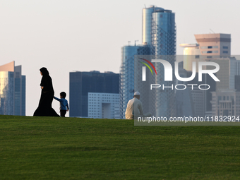 People are seen at mound-skyline view point in Doha, Qatar on December 3, 2024. (