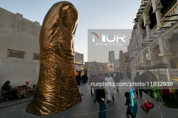 A view of the Golden Thumb Statue at the Souq Waqif in Doha, Qatar on December 3, 2024. 