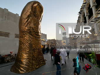 A view of the Golden Thumb Statue at the Souq Waqif in Doha, Qatar on December 3, 2024. (