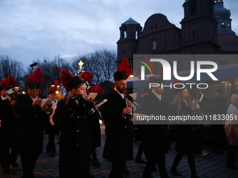 In Nikiszowiec, Poland, on December 4, 2024, the miners' orchestra walks through the streets of the city, traditionally waking up residents...