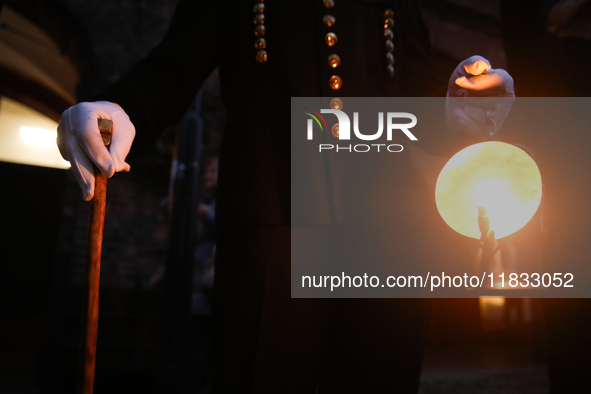 A miner with a lamp participates in the traditional waking up of residents during Barborka in Nikiszowiec, Poland, on December 4, 2024. Barb...