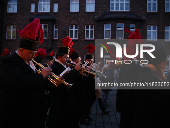 In Nikiszowiec, Poland, on December 4, 2024, the miners' orchestra walks through the streets of the city, traditionally waking up residents...