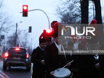 In Nikiszowiec, Poland, on December 4, 2024, the miners' orchestra walks through the streets of the city, traditionally waking up residents...