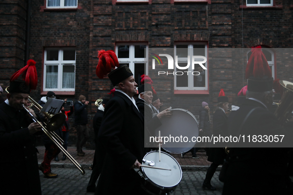 In Nikiszowiec, Poland, on December 4, 2024, the miners' orchestra walks through the streets of the city, traditionally waking up residents...