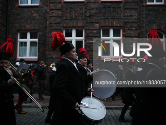 In Nikiszowiec, Poland, on December 4, 2024, the miners' orchestra walks through the streets of the city, traditionally waking up residents...