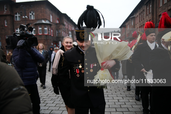 Miner Mariusz proposes unexpectedly during the traditional waking up of residents in Barborka in Nikiszowiec, Poland, on December 4, 2024. B...