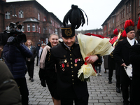 Miner Mariusz proposes unexpectedly during the traditional waking up of residents in Barborka in Nikiszowiec, Poland, on December 4, 2024. B...