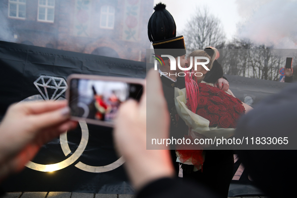 Miner Mariusz proposes unexpectedly during the traditional waking up of residents in Barborka in Nikiszowiec, Poland, on December 4, 2024. B...