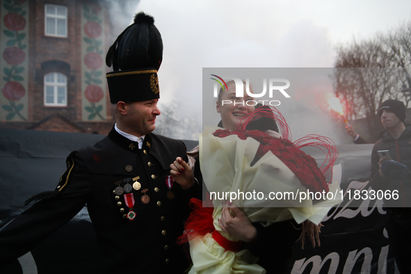 Miner Mariusz proposes unexpectedly during the traditional waking up of residents in Barborka in Nikiszowiec, Poland, on December 4, 2024. B...