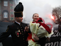 Miner Mariusz proposes unexpectedly during the traditional waking up of residents in Barborka in Nikiszowiec, Poland, on December 4, 2024. B...