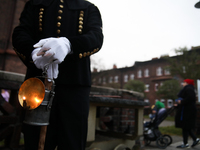 A miner with a lamp participates in the traditional waking up of residents during Barborka in Nikiszowiec, Poland, on December 4, 2024. Barb...