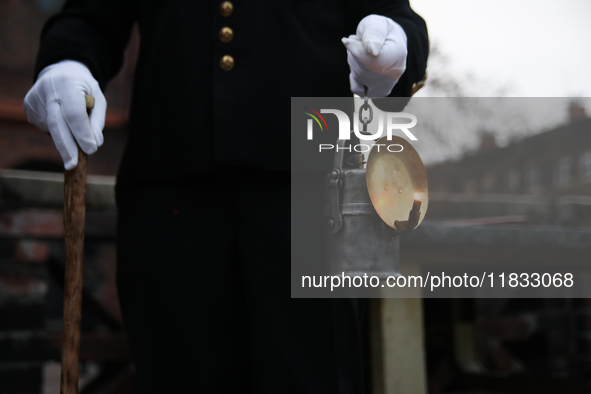 A miner with a lamp participates in the traditional waking up of residents during Barborka in Nikiszowiec, Poland, on December 4, 2024. Barb...