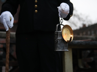 A miner with a lamp participates in the traditional waking up of residents during Barborka in Nikiszowiec, Poland, on December 4, 2024. Barb...