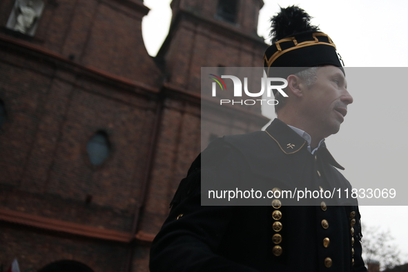 A miner participates in the traditional waking up of residents during Barborka in Nikiszowiec, Poland, on December 4, 2024. Barborka is a tr...