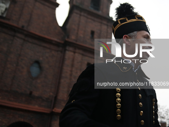 A miner participates in the traditional waking up of residents during Barborka in Nikiszowiec, Poland, on December 4, 2024. Barborka is a tr...