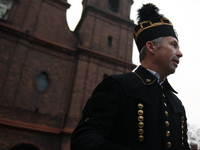 A miner participates in the traditional waking up of residents during Barborka in Nikiszowiec, Poland, on December 4, 2024. Barborka is a tr...