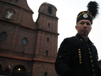 A miner participates in the traditional waking up of residents during Barborka in Nikiszowiec, Poland, on December 4, 2024. Barborka is a tr...